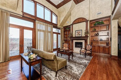 Formal living room has stunning windows for lake a