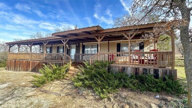 Back of property featuring a porch