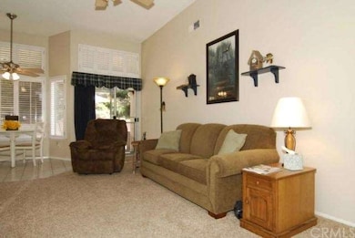 FAMILY ROOM AND PARTIAL VIEW OF THE BREAKFAST NOOK