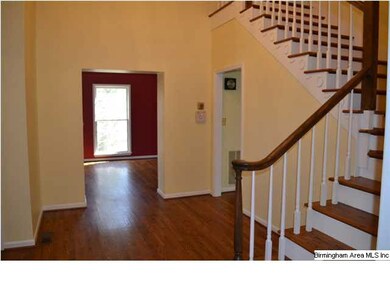 Fantastic two-story foyer with gleaming hardwood f