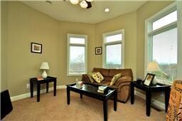 A large office with great views and keep you convenient to the main living area. Open the wonderful casement windows and hear the sounds of the waterfall at the poolside.