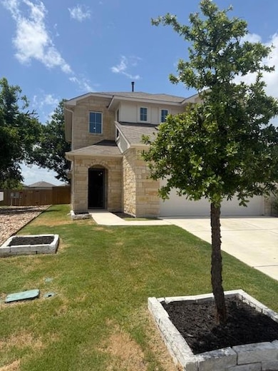 Traditional home with stone siding, driveway, an 