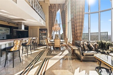 Living room featuring inlaid floor details, a high