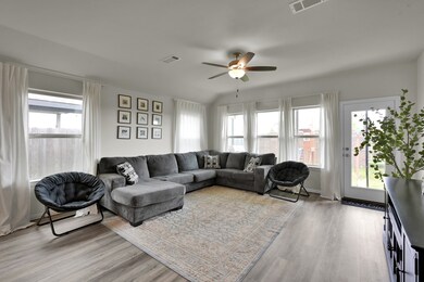 Bright and welcoming living room with upgraded flo
