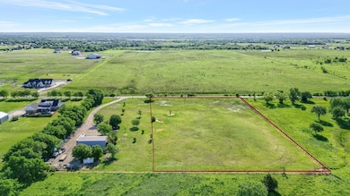 Birds eye view of property featuring a rural view
