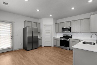 Kitchen featuring appliances with stainless steel