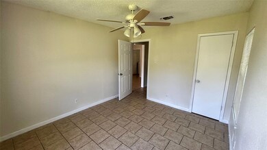 Unfurnished bedroom featuring baseboards, a ceili