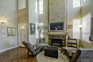 Living room with volume ceilings, tons of windows 