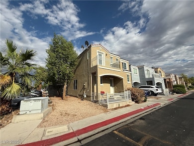 View of front of home featuring a balcony, stucco