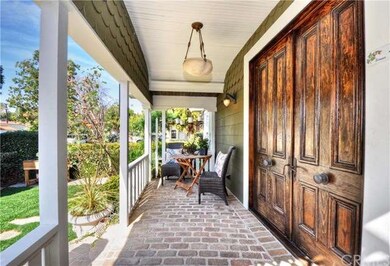 Note the custom wood double door entry and scallop