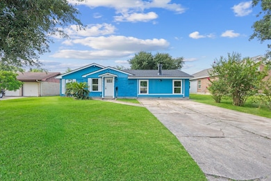 Charming single-story home with vibrant blue exter
