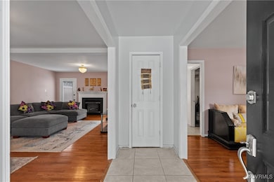 Foyer featuring light tile patterned floors and a
