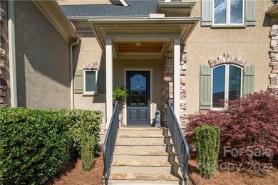 Elegant front entrance with road iron rails.