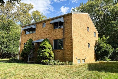 View of side of home with a yard