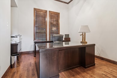 Office featuring dark wood-style flooring
