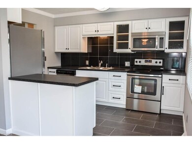 Updated kitchen with stainless steel appliances.