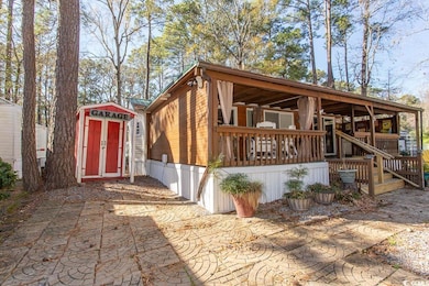Exterior space featuring covered porch and a shed