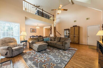 High ceilings with fans and lots of natural light in Family Room