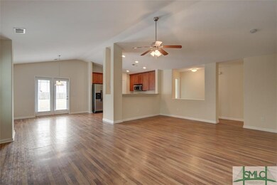 View of kitchen and dining area from living room