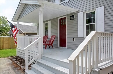 Doorway to property featuring a porch