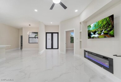Unfurnished living room with marble tiled flooring