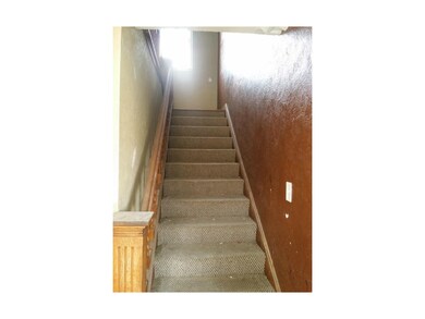 Stair case to 2nd floor where bedrooms are.