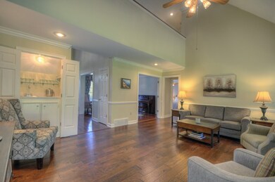 The Great Room features hand scraped hardwood floo
