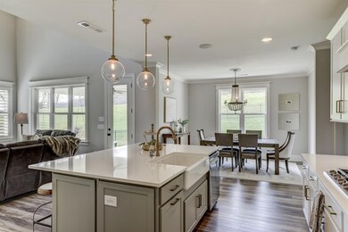 Plenty of seating at the island and dining room area