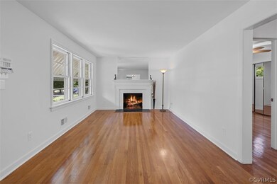 Living room featuring hardwood flooring and ceiling fan