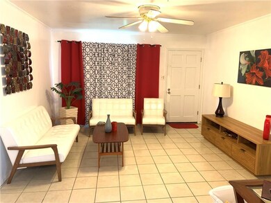 Living Room with tile flooring and ceiling fan tha