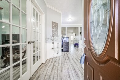 Beautiful vinyl plank flooring enhances the ambiance of this spacious home. French doors effortlessly open up to the study, which can be easily converted into a fourth bedroom if desired..