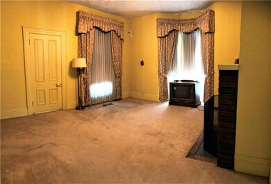 Formal 16x15 living room with F/P.