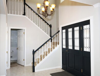 Double Door entry and staircase leading to second floor
