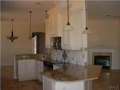 Kitchen has two breakfast bars and stainless steel appliances.