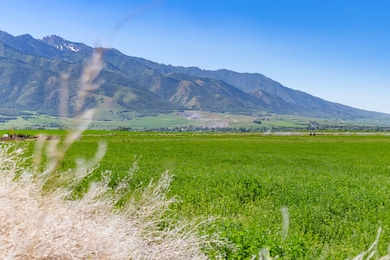 View of mountain backdrop featuring rural landscape