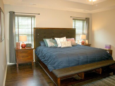 This comfortable floor plan has three bedrooms on the main floor including the master. Decorative tray ceiling and hardwood floors. 
