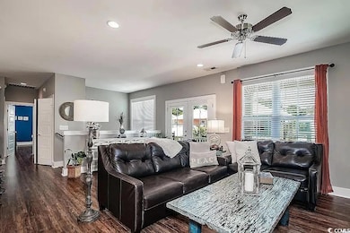 Living room featuring visible vents, baseboards, w
