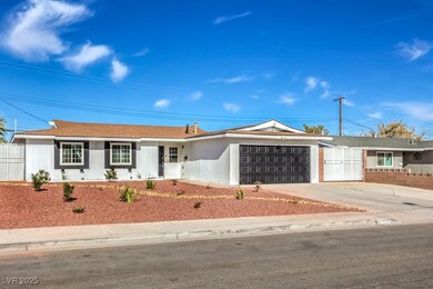 Single story home with concrete driveway, fence, a