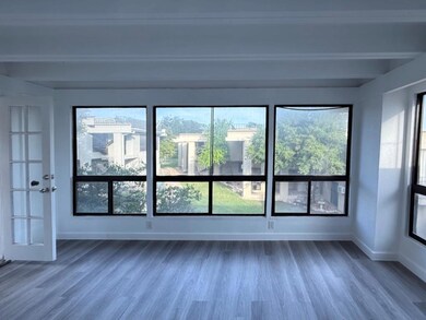Spare room with beam ceiling, wood finished floor