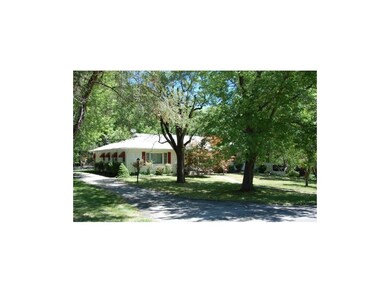 West Side of Home Provides a Driveway and Side Doo