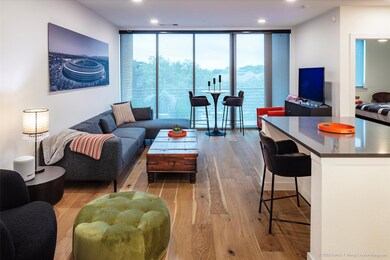 Living room featuring expansive windows, wood fin