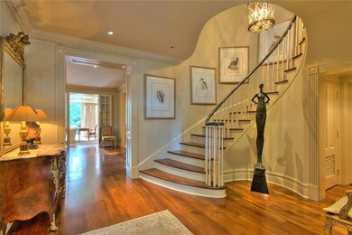 Grand entrance leads to study/office and living an