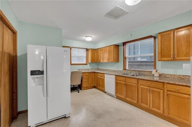 Large Kitchen with a Built- in desk and a good size Pantry. Double Sink by the window. Lots of beautiful wood cabinetry.