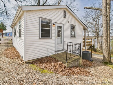 Side porch to backyard and laundry shed.