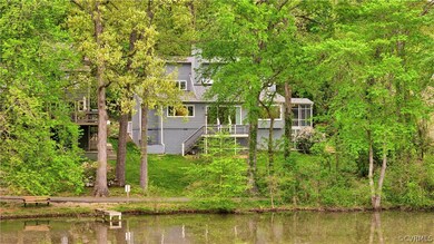 Rear view of house featuring a water view