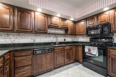 Large cherry kitchen with new granite counters