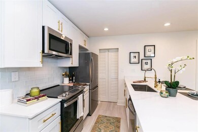 Kitchen featuring sink, decorative backsplash, sta
