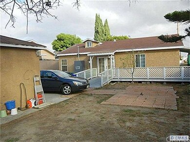 Back of the house has a small patio and ramp for e