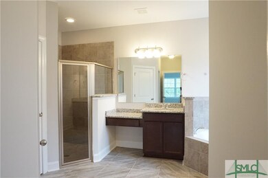 The Master Bathroom has separate granite counter t