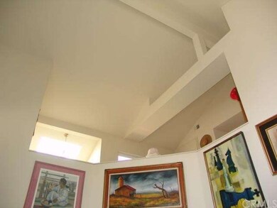 Soaring ceiling and architectural detail above liv